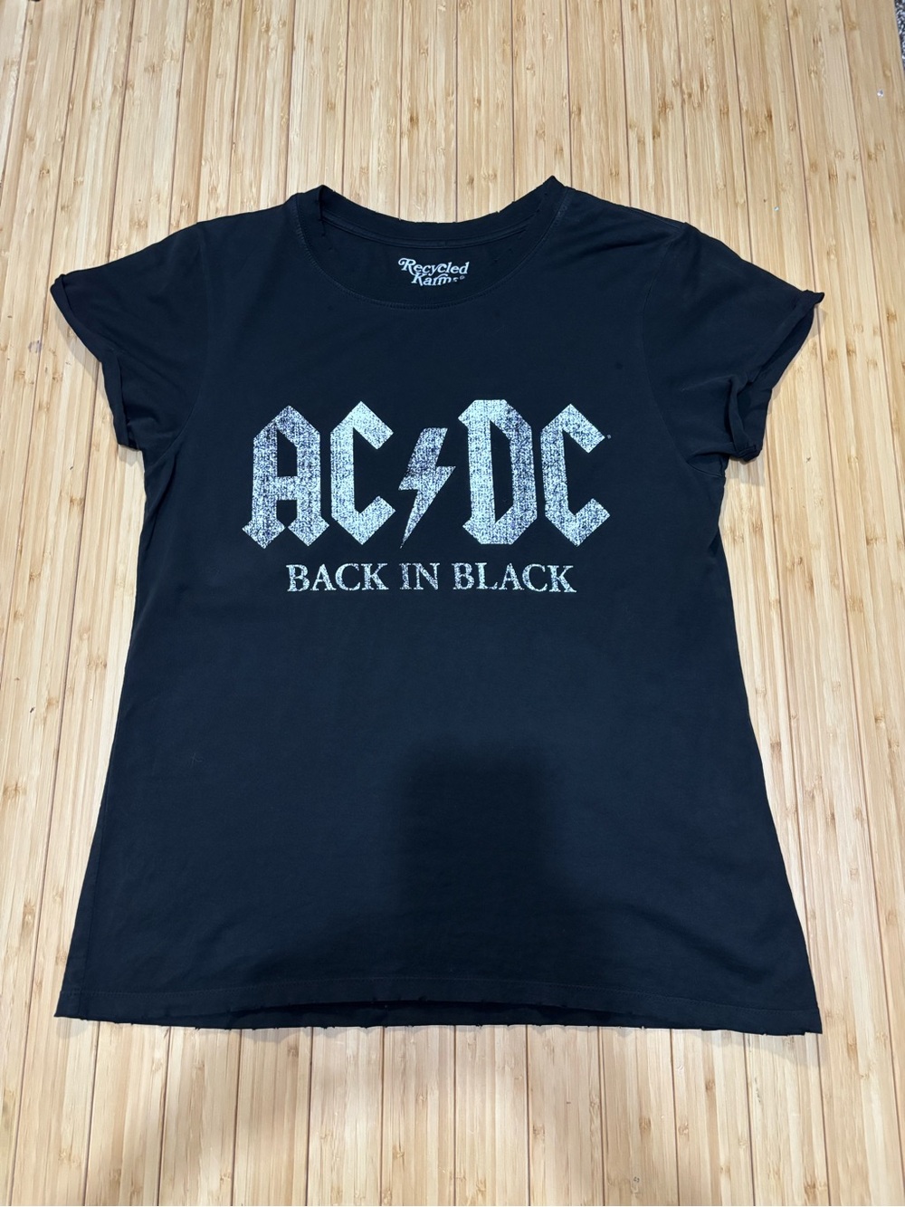 Women’s graphic tee shirt. Size S. Rolled sleeves. Distressed neck and hemline.